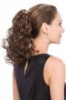 Woman in a 14" curly medium brown clip in ponytail hairpiece