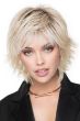 Woman in a shoulder length razor cut light blonde wig with fringe bangs