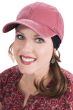 Woman in red distressed baseball cap for cancer patients