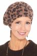 Woman in fuzzy leopard print winter beret hat