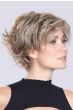 Woman in a large short shaggy asymmetric light blonde lace front bob wig with wispy bangs