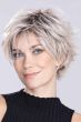Woman in a short shaggy asymmetric silver lace front bob wig with wispy bangs