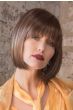 Woman in brown blunt cut bob wig with bangs