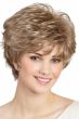 Woman in a long wavy medium blonde pixie wig