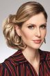 Woman in 5" to 6" light brown clip in hairpiece updo wig