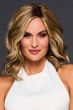 Woman in a shoulder length warm light brown wavy lace front wig