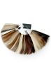 A metal ring containing hair swatches from the Raquel Welch human hair collection