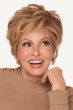 Raquel Welch in a short, choppy light auburn lace front wig