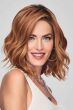 Woman in a medium auburn angled curly lace front bob wig