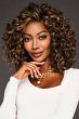 Black woman in a shoulder length ultra curly medium auburn wig