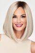 Woman in a shoulder length platinum blonde blunt lace front wig