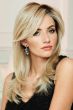 Woman in an extra long past the shoulders wig with long layers and side bangs