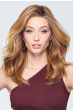 Woman in an extra long light auburn wavy lace front wig with long layers