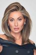 Woman in a past the shoulders dark brown lace front wig with long layers