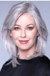 Woman in a shoulder length straight silver lace front wig