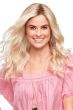 Woman in a an extra long platinum blonde curly lace front wig