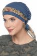 Woman in blue chemo beanie with scarf looped through the head covering