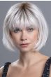 Woman in a chin length silver lace front rounded bob with fringe bangs