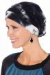 Woman in black and white tie dyed turban snood for cancer patients