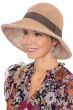 Woman in natural finely woven brimmed outdoor sun hat for petite heads with brown decorative band for cancer patients