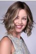 Woman in short wavy bob wig by Bell Tress in dirty blonde