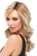 Woman in a long blonde lace front wig with barrel curls