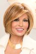 Raquel Welch in a face framing chin length light auburn bob wig with long side bangs