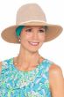 Woman in summer straw fedora hat for women with turquoise head scarf underneath for cancer patients