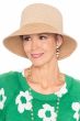 Woman in summer straw bucket hat with UPF sun protection for cancer patients