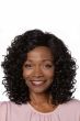 Afro American woman in a shoulder length black coily curly wig