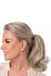 Woman in a 14" ash blonde clip in ponytail