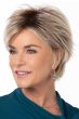 Woman in a large light blonde long pixie wig with side bangs