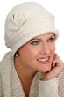 Woman in textured cream cloche hat with side flower