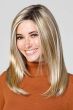 Woman in an 18" straight light blonde lace front hair topper for thinning hair