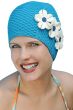 Woman in blue textured rubber swim cap with white flowers on the side