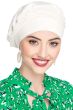 Bald woman wearing cream beret hat