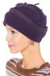 Woman in cute purple winter beanie hat with embroidered trim for cancer patients