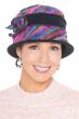 Woman in blue tweed winter hat with side flower, brim and colorful fabric inserts