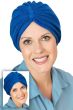 Women in blue terry cloth turban, show worn two ways for cancer patients