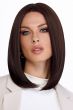 Woman in a past the shoulders platinum blonde lace front wig with long layers