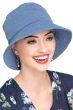 Woman wearing light blue bucket hat with UPF protection