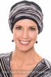 Woman in a black three seam turban with an oversized cinched bamboo headband on top