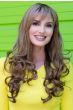Woman in an extra long light brown curly wig with side bangs