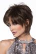Woman in a short, dark brown long layered human hair wig with wispy bangs