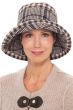 Woman in brown plaid fall and winter bucket hat with upturned brim