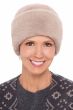 Woman in fuzzy winter cuffed beanie cap for cancer patients