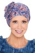 Woman over 50 in blue floral slouchy style chemo cap