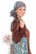 Woman in handmade head scarf with matching tote bag, with maltese dog in bag