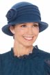 Woman in blue winter wool cloche hat for cancer patients with side flower