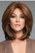 Woman in a shoulder length medium brown human hair wig with long layers